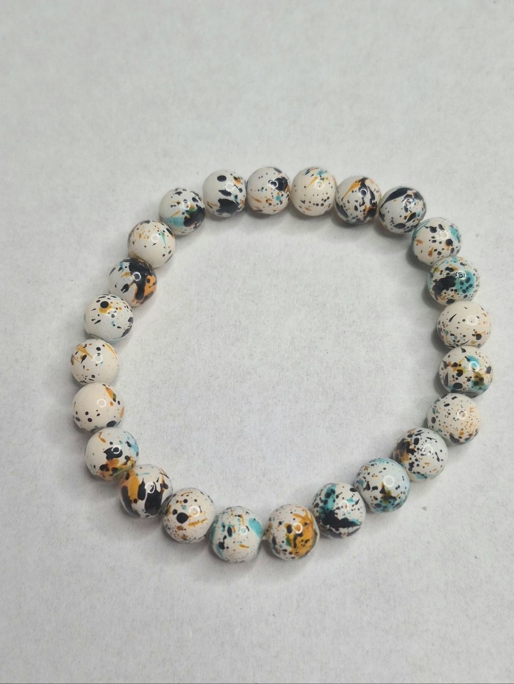 Stylish White w/ Paint-spatter Beaded Stretch Bracelet